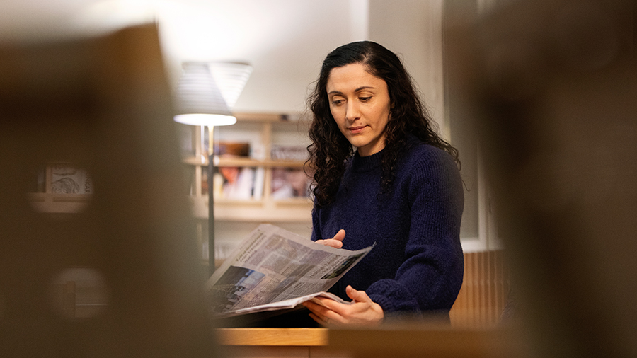 A person reading a newspaper